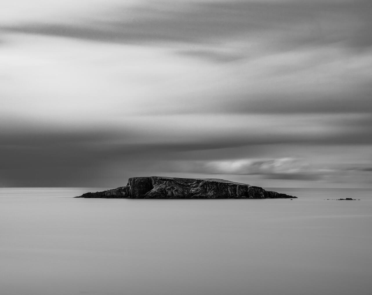Black and white long-exposure photograph of Adam Island in Glandore Harbour, West Cork, Ireland.