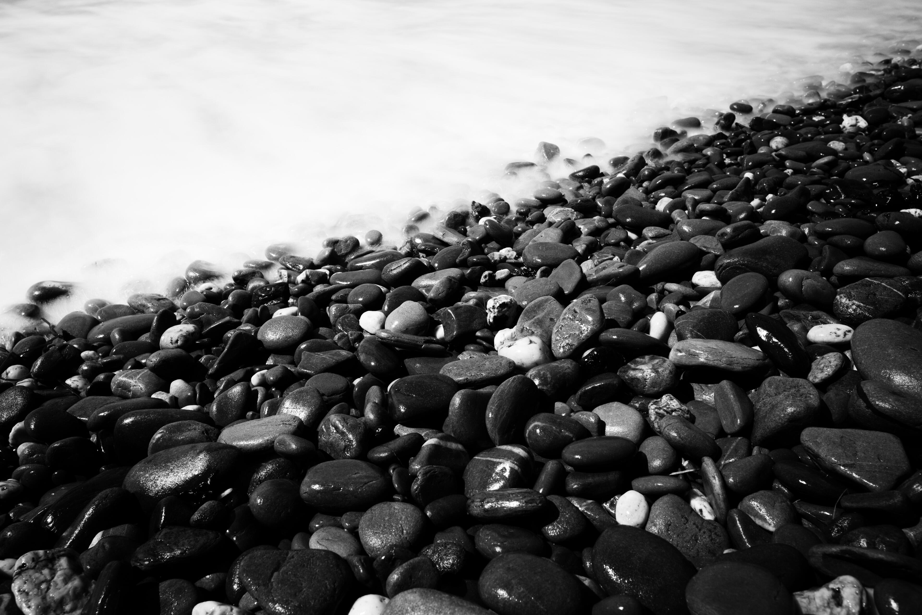 Here, the sea never truly stops, yet in a single moment it becomes still. The stones have waited through countless tides, while the water whispers across them without a sound. Sometimes the most powerful part of a landscape isn't what is moving... It's th